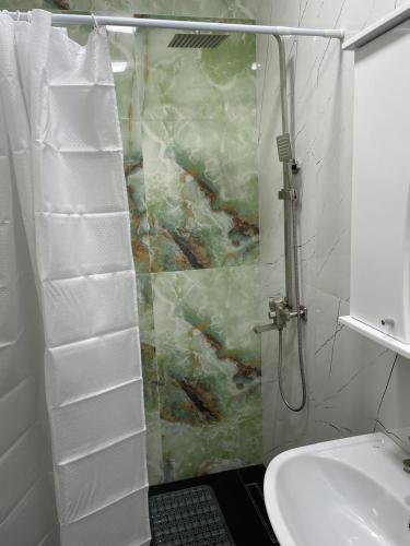 a bathroom with a shower and a sink at Dream home in Vanadzor