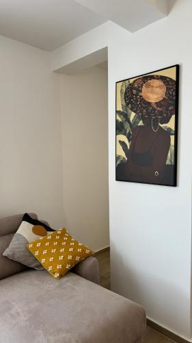 a room with a couch and a painting on the wall at Jadran Dream2 in Rafailovici