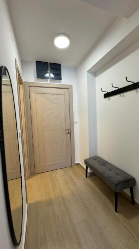 a room with a door and a bench in front of it at Jadran Dream2 in Rafailovici