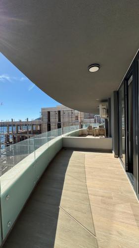 an empty balcony with a view of a building at Jadran Dream2 in Rafailovici