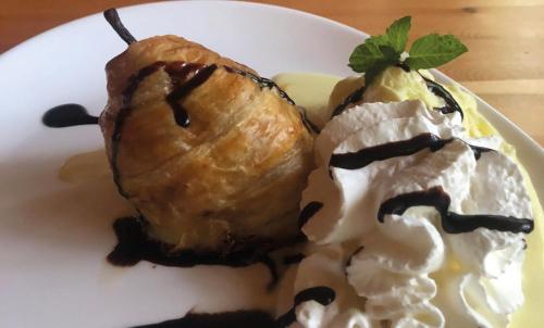 a plate of food with a pastry and ice cream at Les Park Vřesovice in Vřesovice