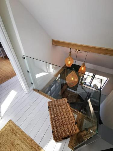 an overhead view of a room with a table and chairs at The Architects Home in Stow on the Wold