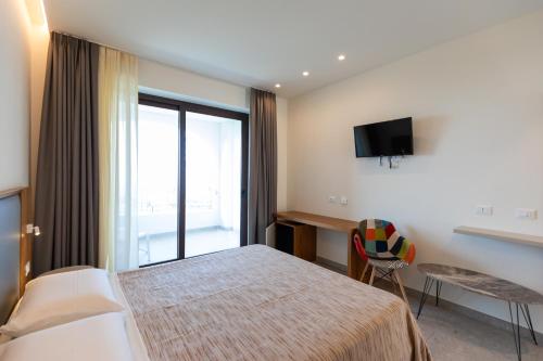 Ένα ή περισσότερα κρεβάτια σε δωμάτιο στο LUZIA AGRIRESORT Amazing Nature Atmosphere