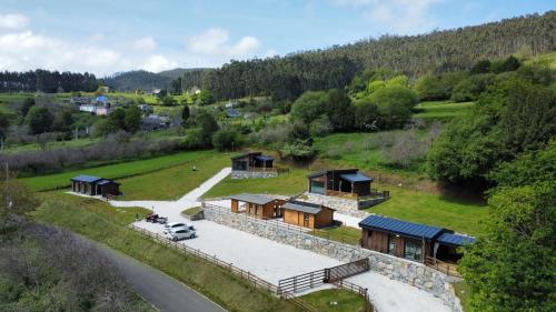 an aerial view of a house on a hill at Cabañas O Recuncho do Sor in O Barqueiro