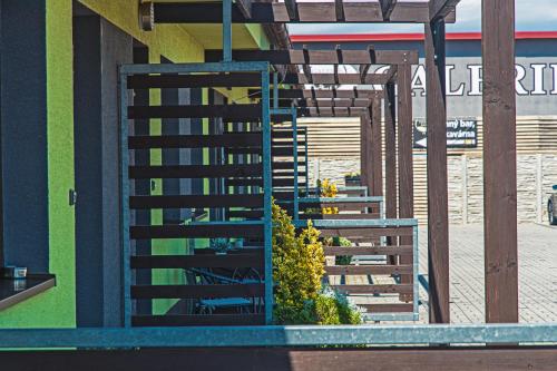 a view of a building with stairs and plants at Penzion Stará hora in Velké Pavlovice