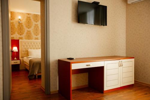 Ένα ή περισσότερα κρεβάτια σε δωμάτιο στο Aparthotel Holiday Lux Batumi