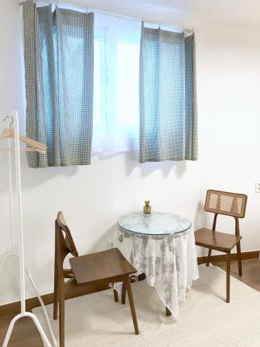 a dining room with a table and a chair at Eoulim Guesthouse 2 in Andong