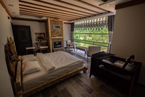 Una cama o camas en una habitación de Vadi Taş Konak