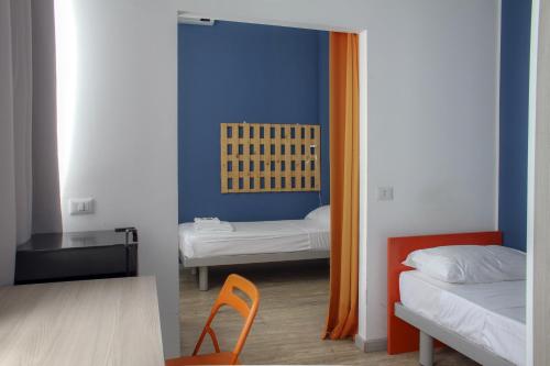 Ένα ή περισσότερα κρεβάτια σε δωμάτιο στο La Cordata Accommodation - Woodhouse Bike Hotel