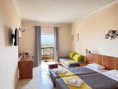 Postel nebo postele na pokoji v ubytování Ariadne Apartments