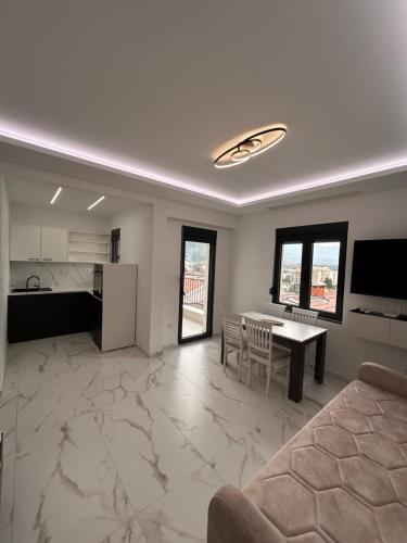 Η κουζίνα ή μικρή κουζίνα στο Merlin Prestige Apartments