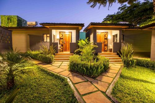 a house with a pathway leading to the front yard at Gigiri Lion Villas I in Nairobi