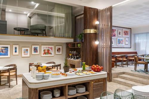 a restaurant with a table with food on it at Radisson Hotel Cape Town Foreshore in Cape Town
