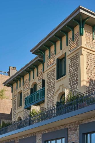 a building with balconies on the side of it at Nobu Hotel San Sebastián in Donostia-San Sebastián