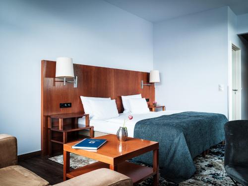 Ένα ή περισσότερα κρεβάτια σε δωμάτιο στο AMERON Hotel Abion Spreebogen Berlin