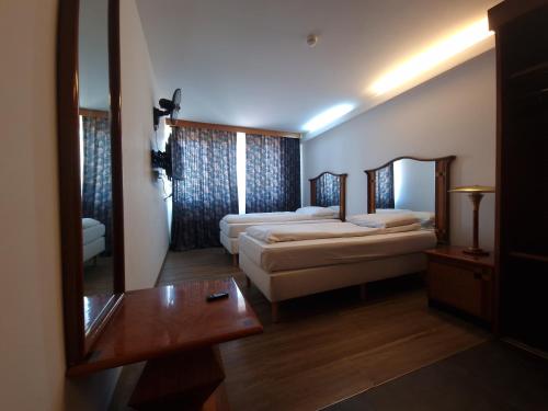 Una cama o camas en una habitación de SKY APART HOTEL - Hotel EUROCAP