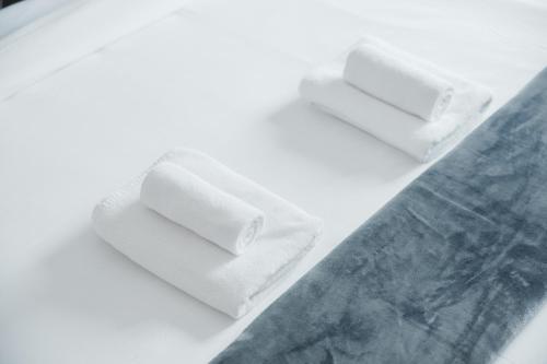 two rolls of toilet paper sitting on top of a table at Charming 1BR in The Greens, Near Metro in Dubai