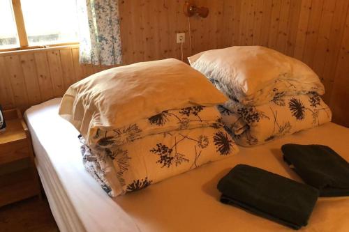 two pillows on a bed in a room at The Golden Circle Cabin in Selfoss
