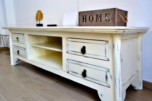 a white desk with drawers and a box on top at Evaleta 2, precioso apartamento recién estrenado in Monachil