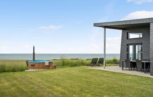 a house with a patio and a swimming pool at Cozy Home In Kalundborg With Kitchen in Kalundborg