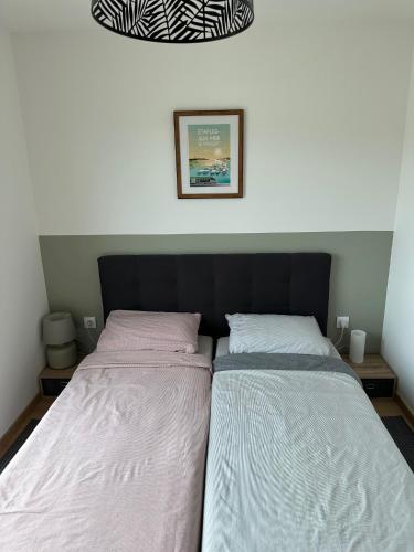 two beds sitting next to each other in a bedroom at Etaples Canche Belle Vue in Étaples