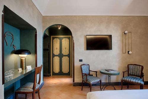 a room with two chairs and a table and a door at San Francesco al Monte in Naples
