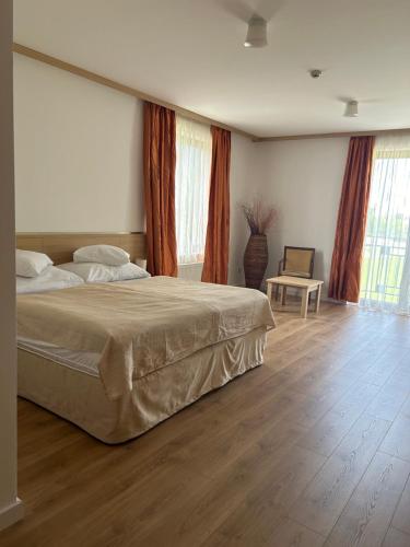 Postel nebo postele na pokoji v ubytování Hotel Legend