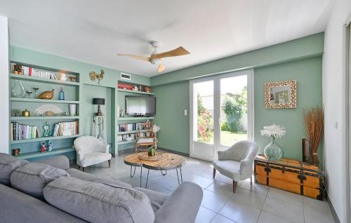 a living room with a couch and a table at 3 Bedroom Beautiful Home In Remoulins in Remoulins