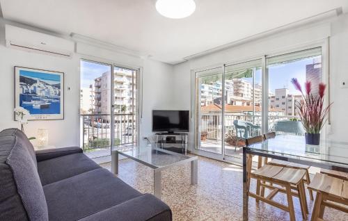 a living room with a couch and a table at 3 Bedroom Nice Apartment In Santa Pola in Santa Pola