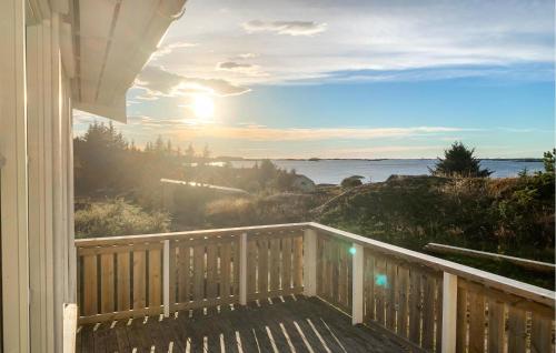 a house balcony with a view of the ocean at 3 Bedroom Nice Home In Kvenvær in Kvenvær