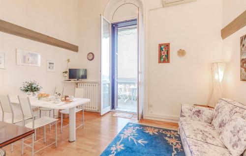 a living room with a table and a couch at 1 Bedroom Lovely Apartment In Grimaldi in Grimaldi