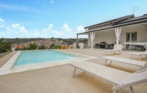a swimming pool on the roof of a house at Cozy Home In Giarratana With Wifi in Giarratana
