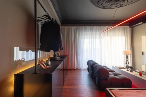 a living room with a couch and a table at ETERN Apart-Hotel II in Pristina