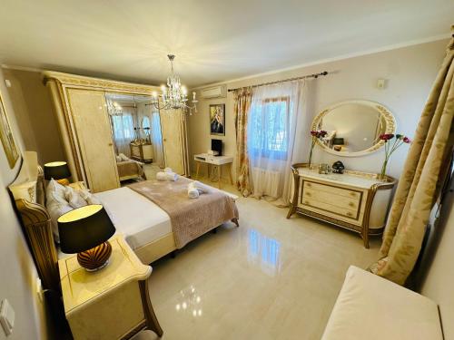 a bedroom with a large bed and a mirror at Casa Sofia in Calpe