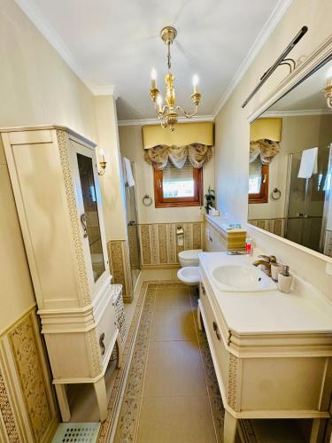 a bathroom with a sink and a toilet at Casa Sofia in Calpe