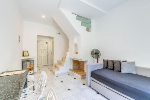 a bedroom with a bed and a fireplace at Doliva Studio John private jacuzzi in Agios Gordios