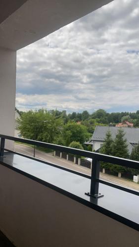 a view of a balcony with a view of trees at APARTAMENT MARTA in Biłgoraj