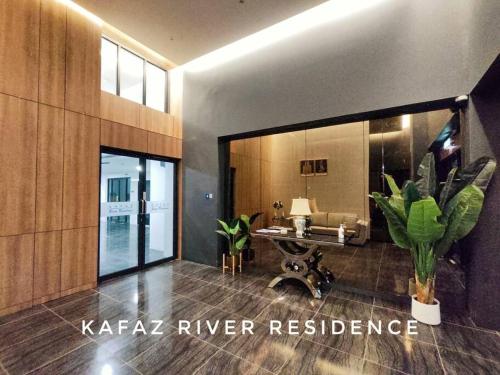 a living room with a large mirror and a couch at Kafaz2-Kpg Patingan 3Bedroom 3 Bathroom -first floor in Kuching