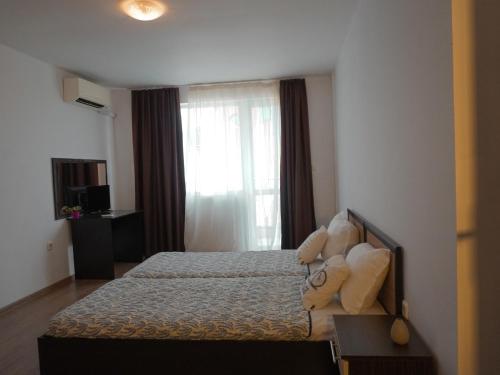 Postel nebo postele na pokoji v ubytování Jolly apartments