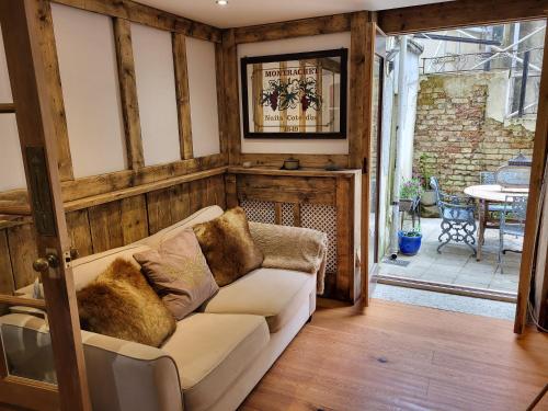 a living room with a couch and a table at Seaside hideaway st Leonards in Hastings