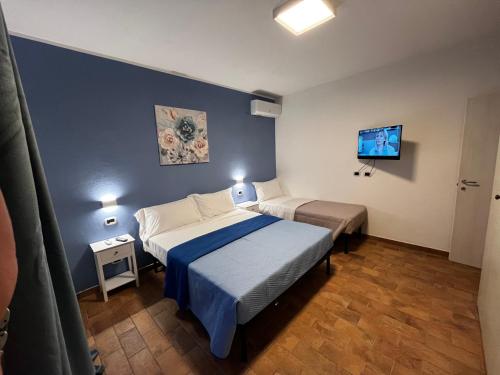 Postel nebo postele na pokoji v ubytování Appartamento Azzurro Mare