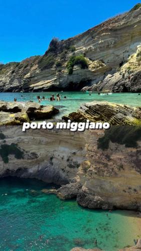 a group of people in the water at a beach at Il villino di nonna Domenica in Lecce