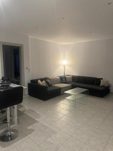 a living room with a couch and a table at Casa Nostra Mykonos Boutique Rooms & Studios in Glastros