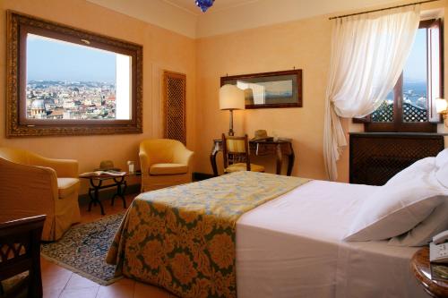 a hotel room with a bed and a window at San Francesco al Monte in Naples