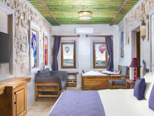 Ένα ή περισσότερα κρεβάτια σε δωμάτιο στο Rapsodi Cappadocia
