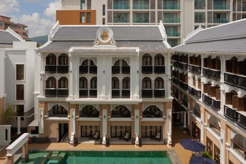 an aerial view of a building with a swimming pool at CHINO@NIMMAN Luxury Boutique Hotel in Chiang Mai