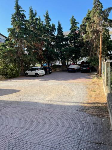 a parking lot with several cars parked in it at Chili Seaside 2 in Nea Chili