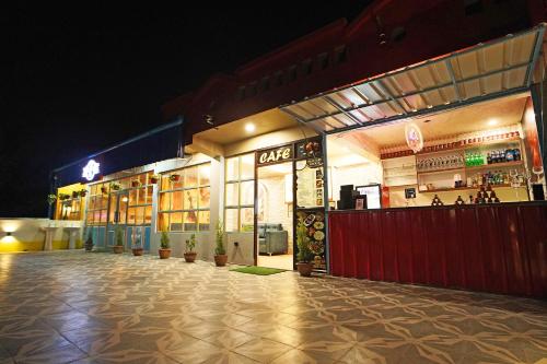 a store front of a restaurant at night at PS Luxury Hotel in Baharampur