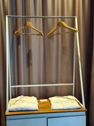 a table with two towels on top of a curtain at Chiko Group in Aspindza