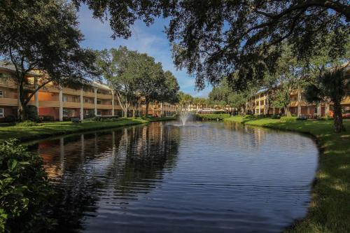 a river with a fountain in the middle at Westgate Leisure Resort in Orlando